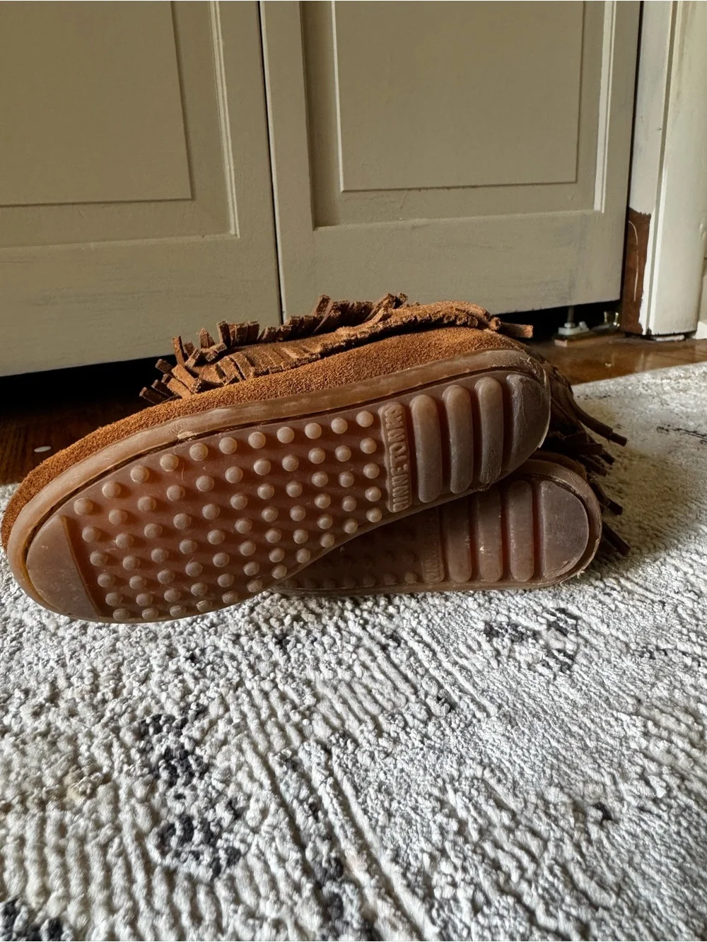 Minnetonka Tan Suede Moccasin Label Close-Up